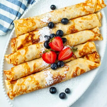 Brown butter crepes on a platter.