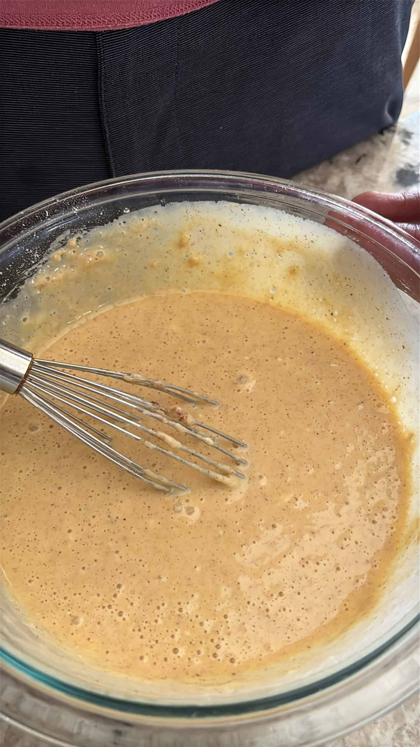 Brown butter crepe batter in a bowl.