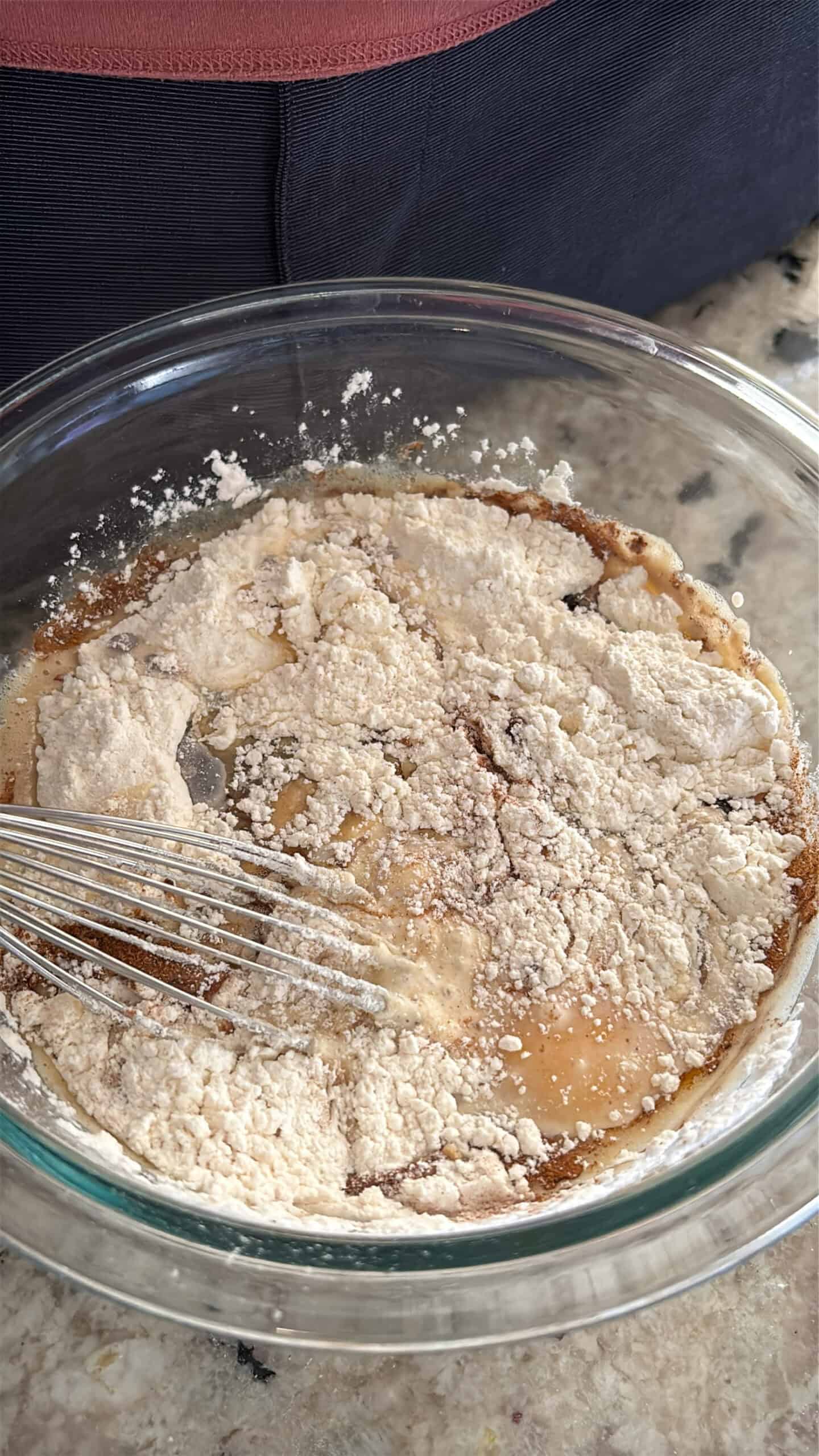 Brown butter crepes dry and wet ingredients in a bowl.