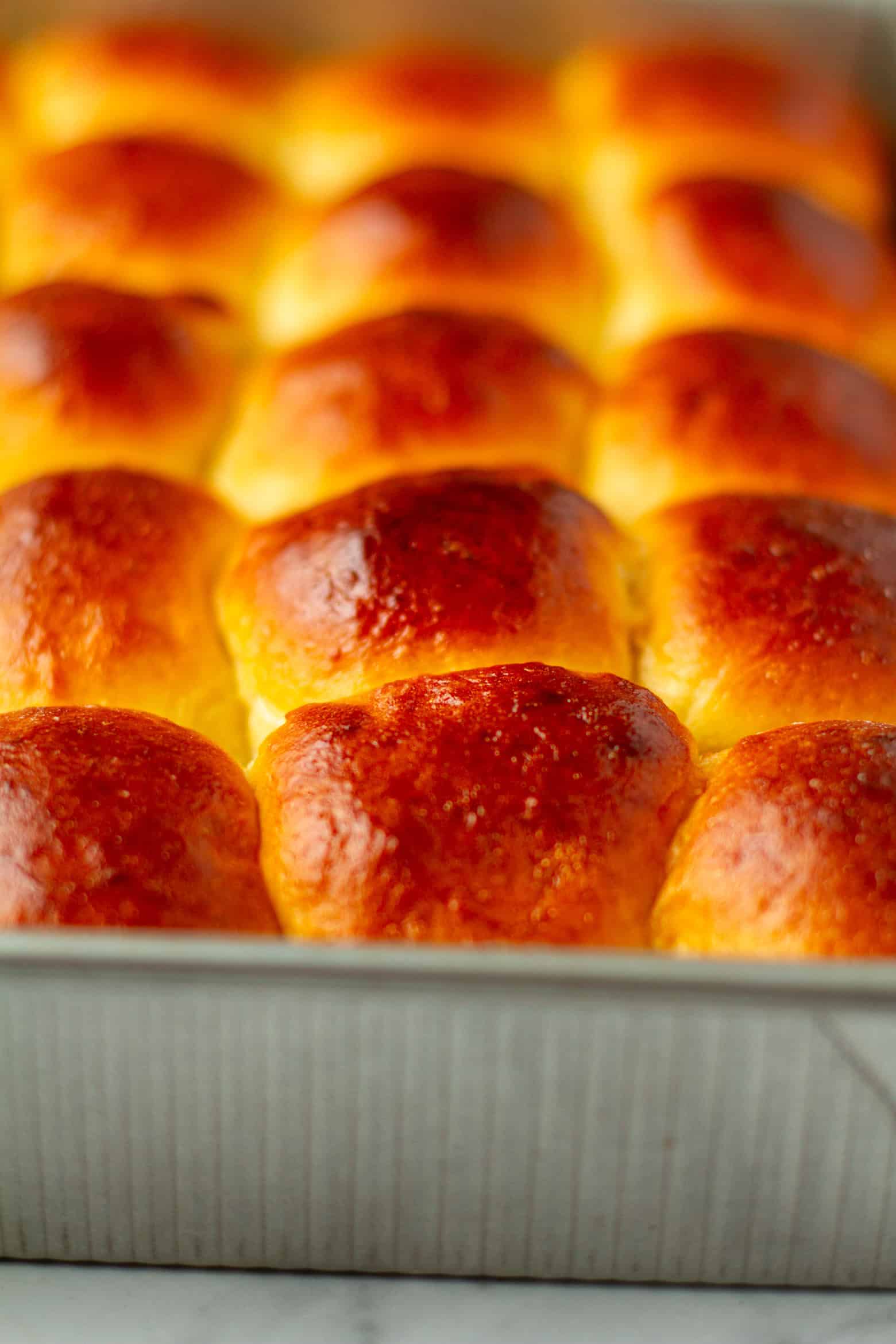 Close up of Hawaiian Dinner Rolls in a baking pan.