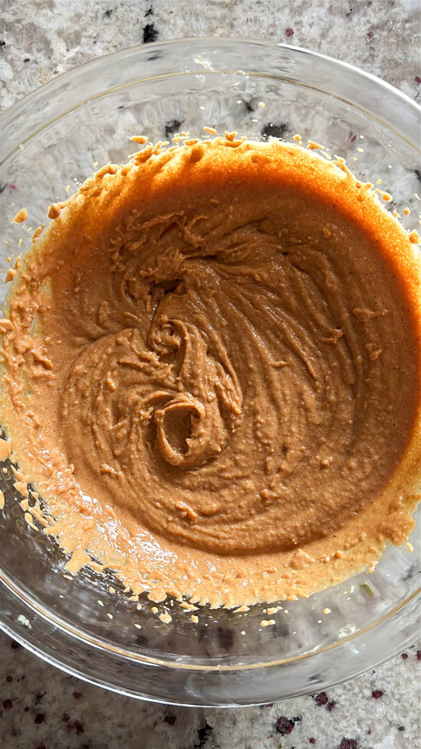 peanut butter and sugar creamed in a bowl.