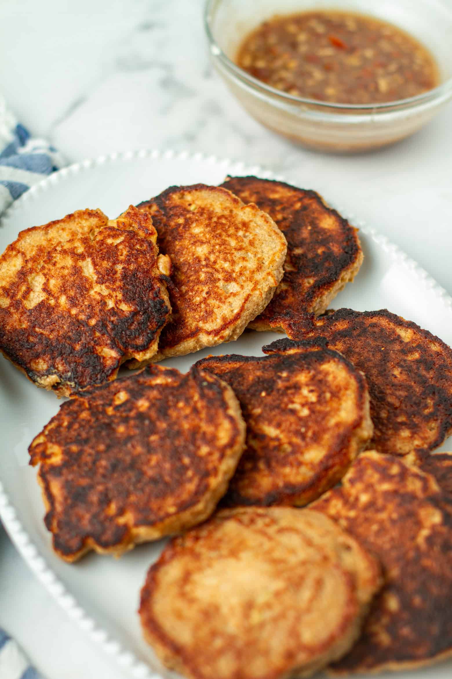 Apple oat pancakes on a platter.