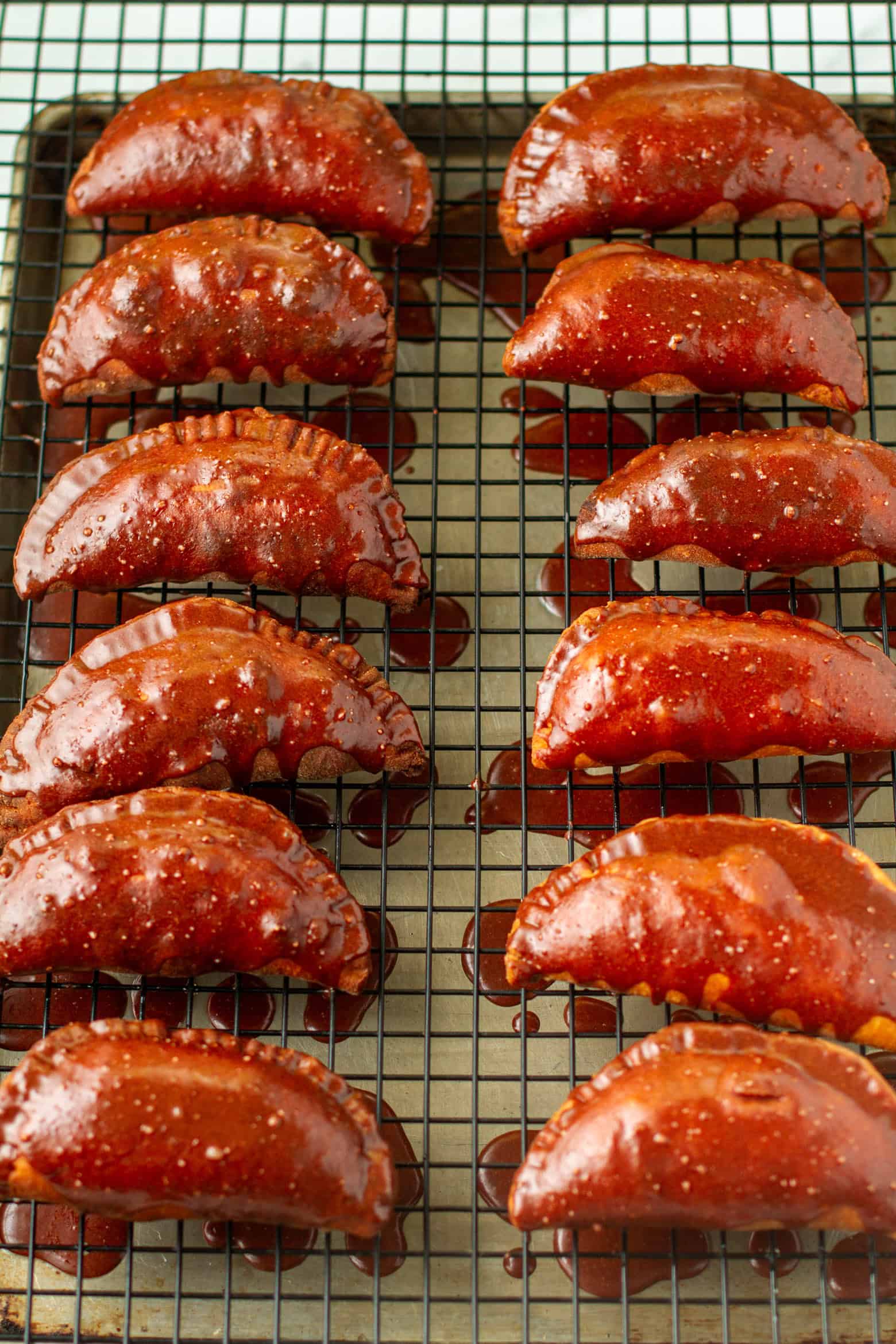 Chocolate glazed hand pies on a cooling rack