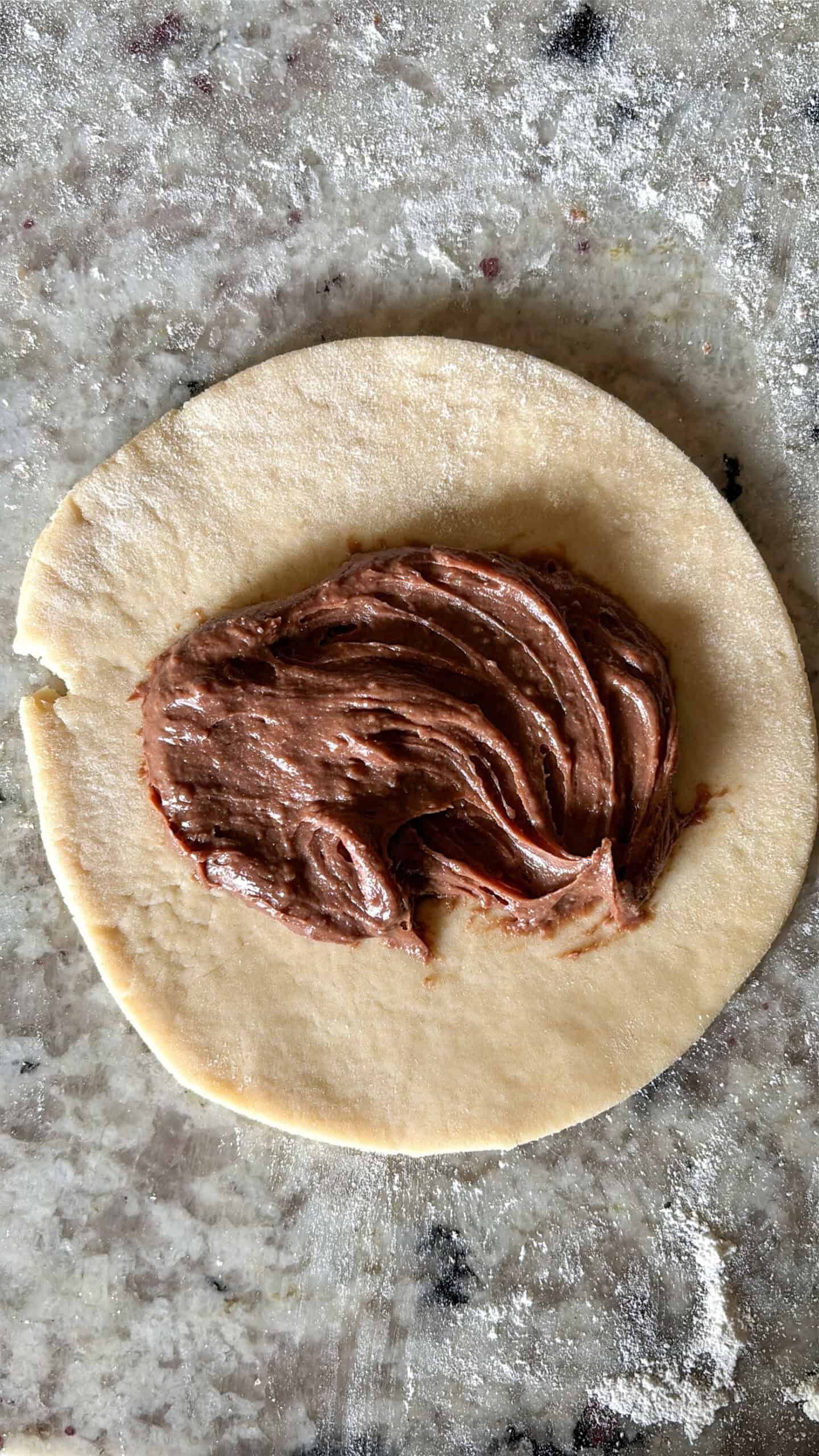 Chocolate filling added to a rolled out hand pie dough.