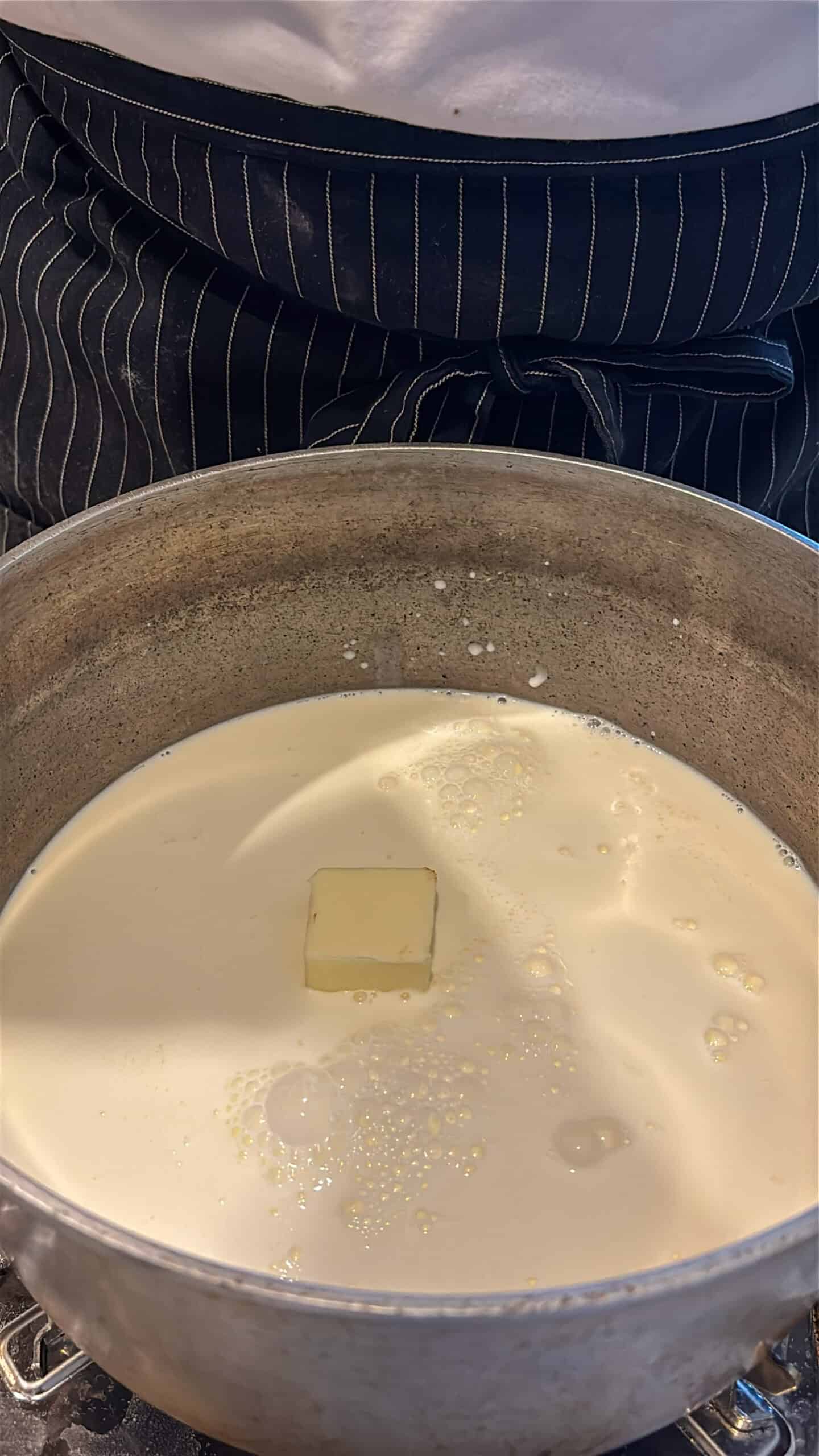 Hot milk and butter in a pot.