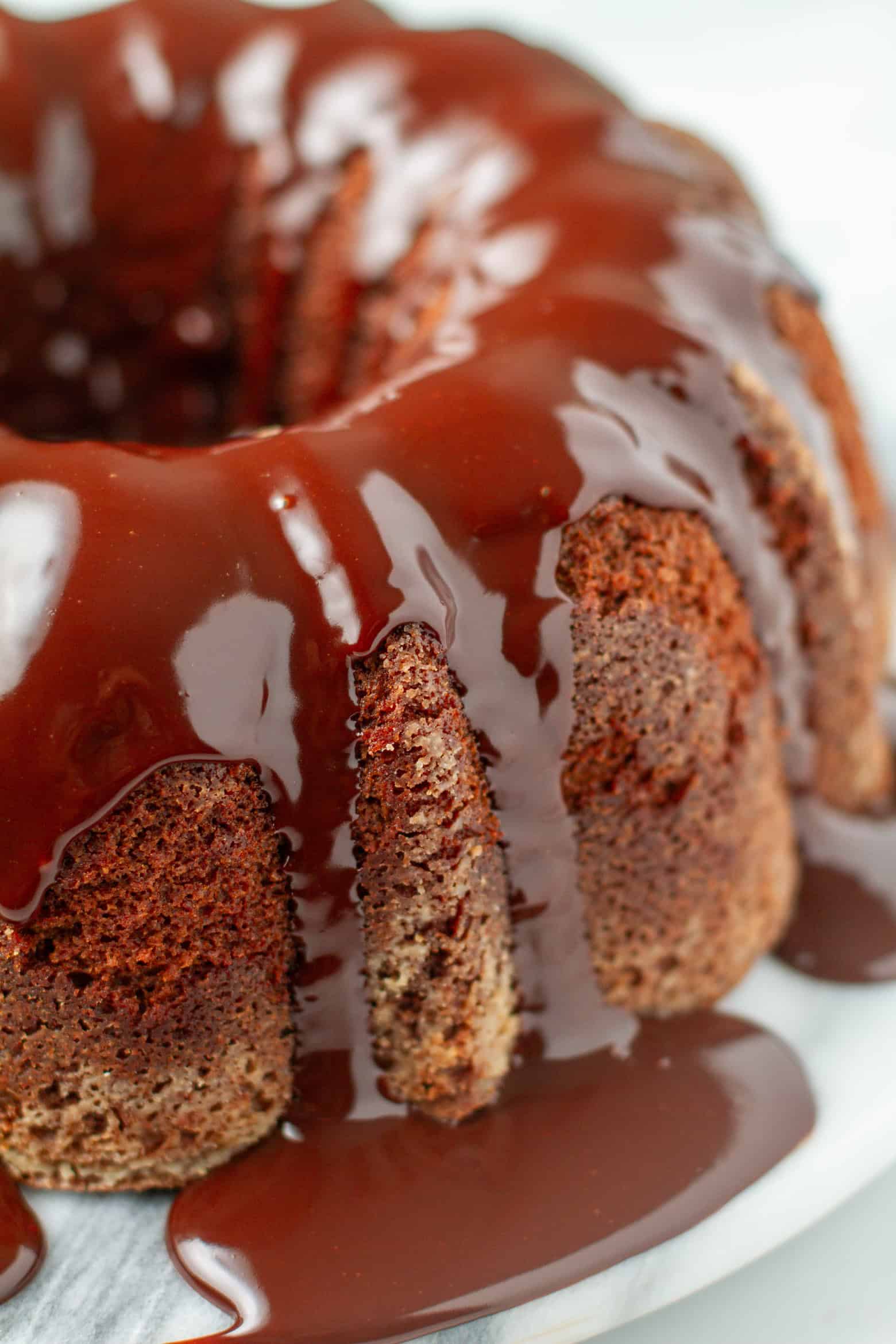 Side shot of glazed chocolate whiskey cake.