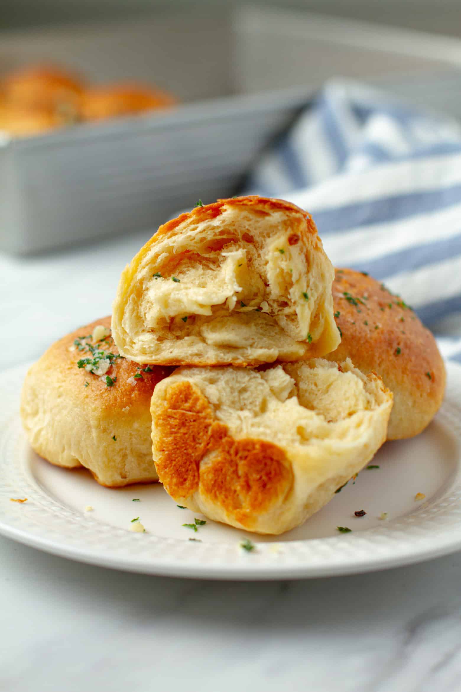 garlic rolls opened and on a plate.