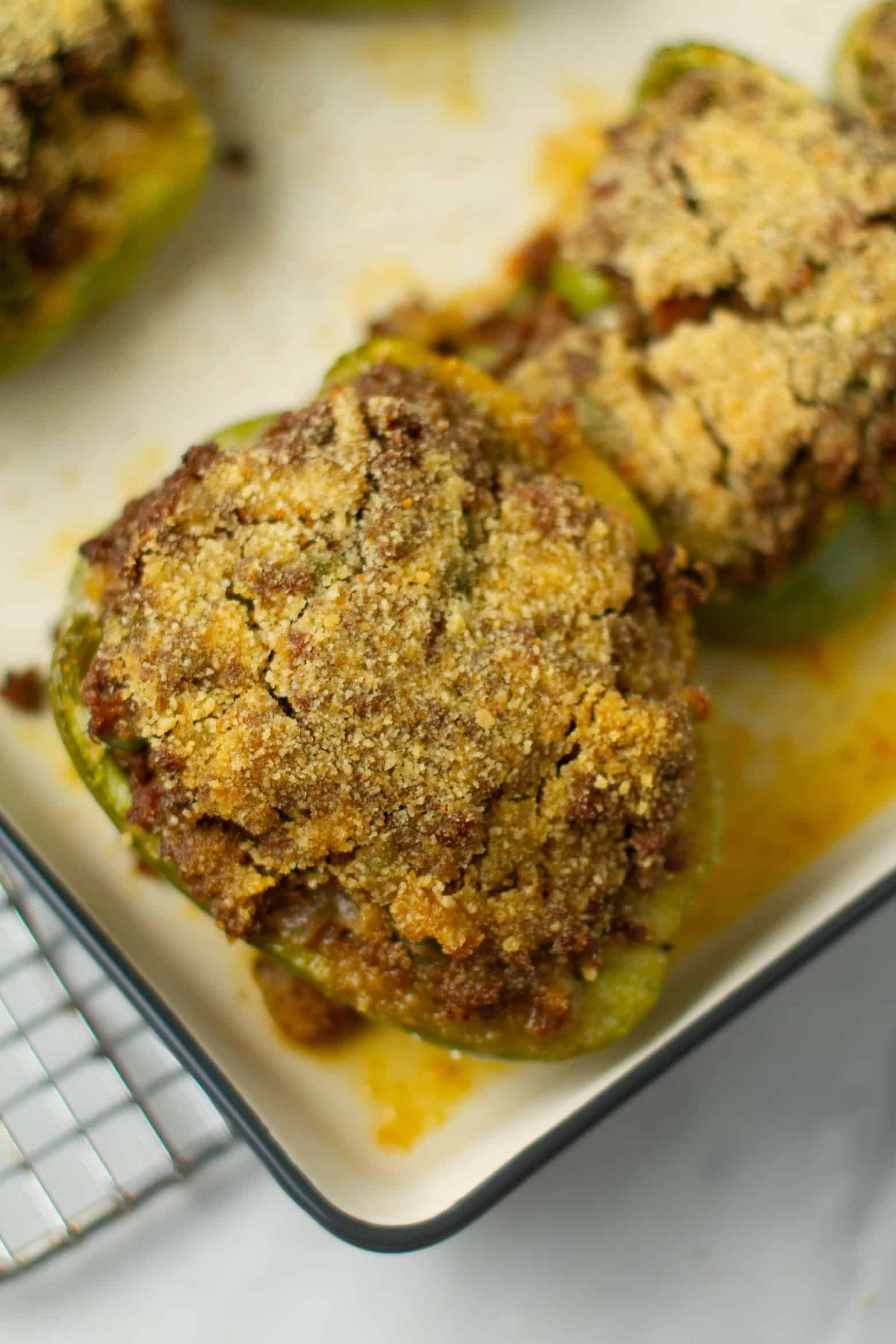Cooked stuffed bell pepper on a baking sheet.