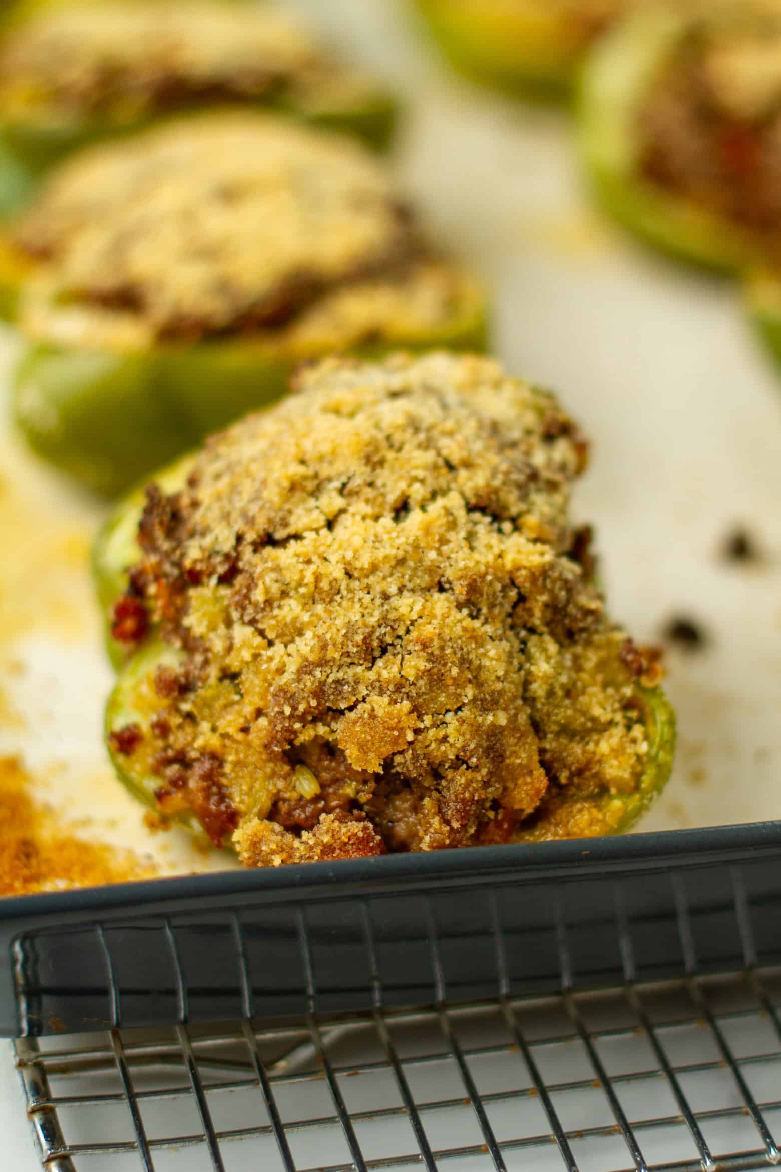Cooked stuffed bell pepper on a baking sheet.