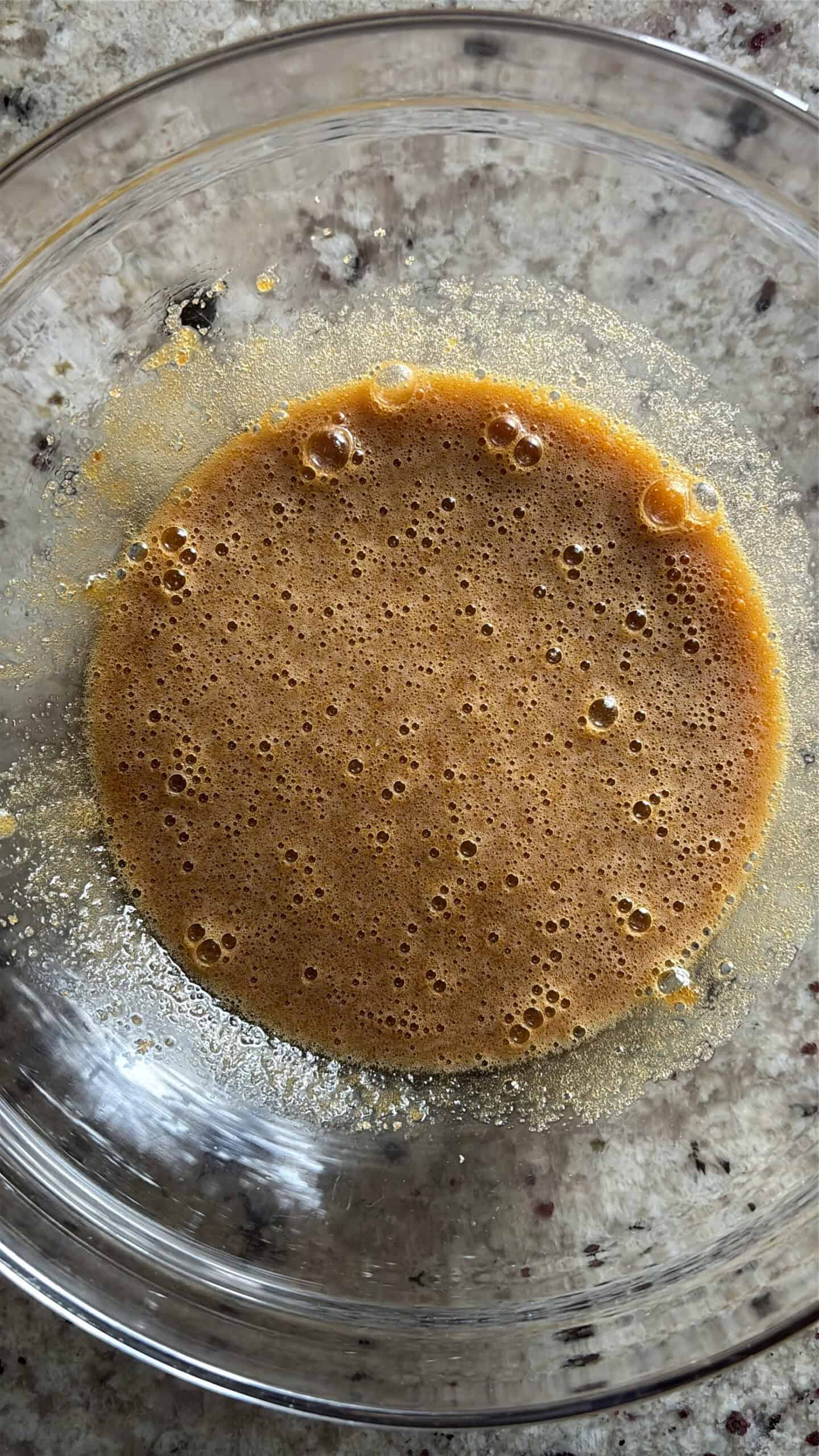 Sugar and butter combined in a bowl.