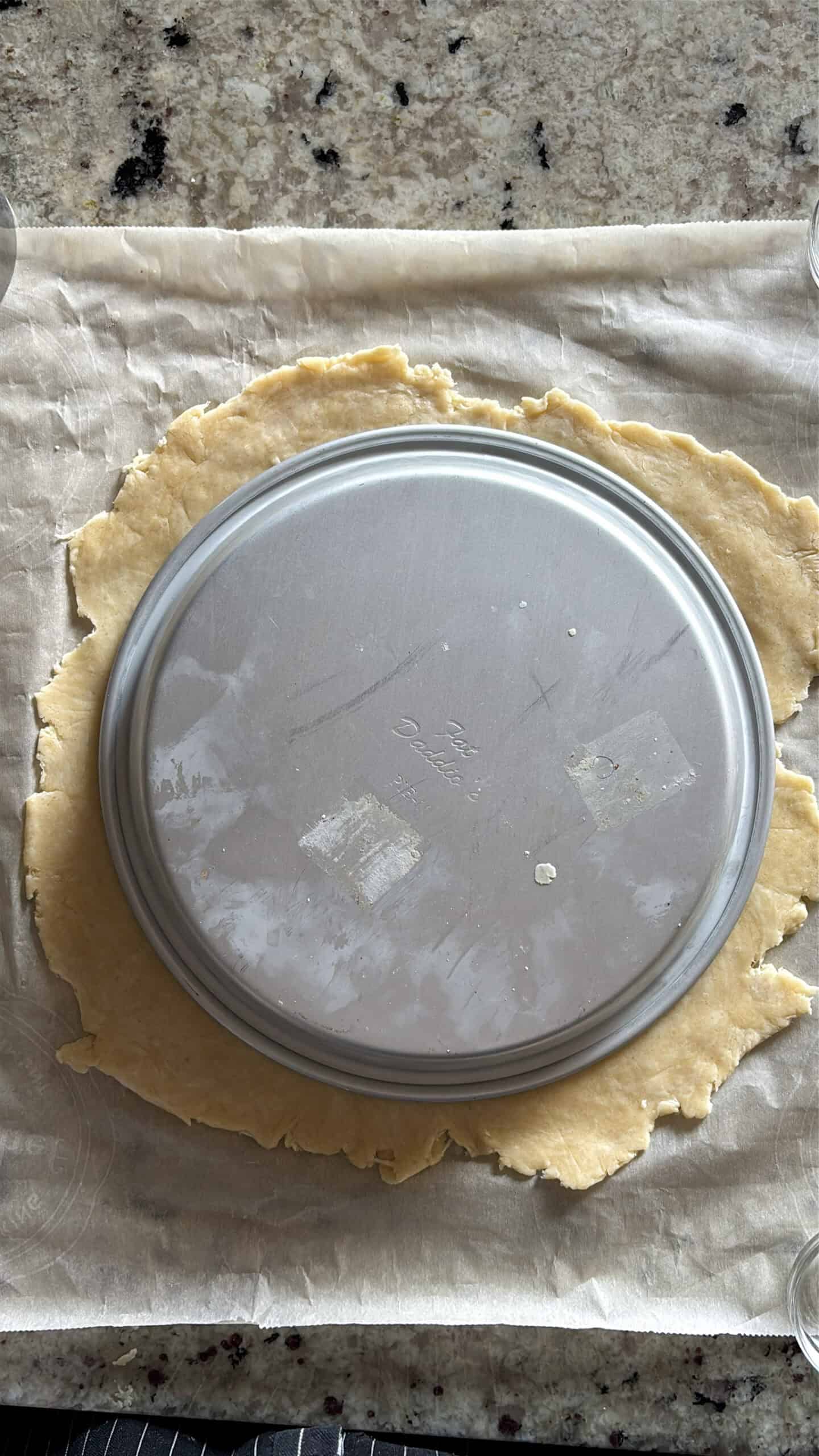 Rolled out pie crust wider than pie pan.