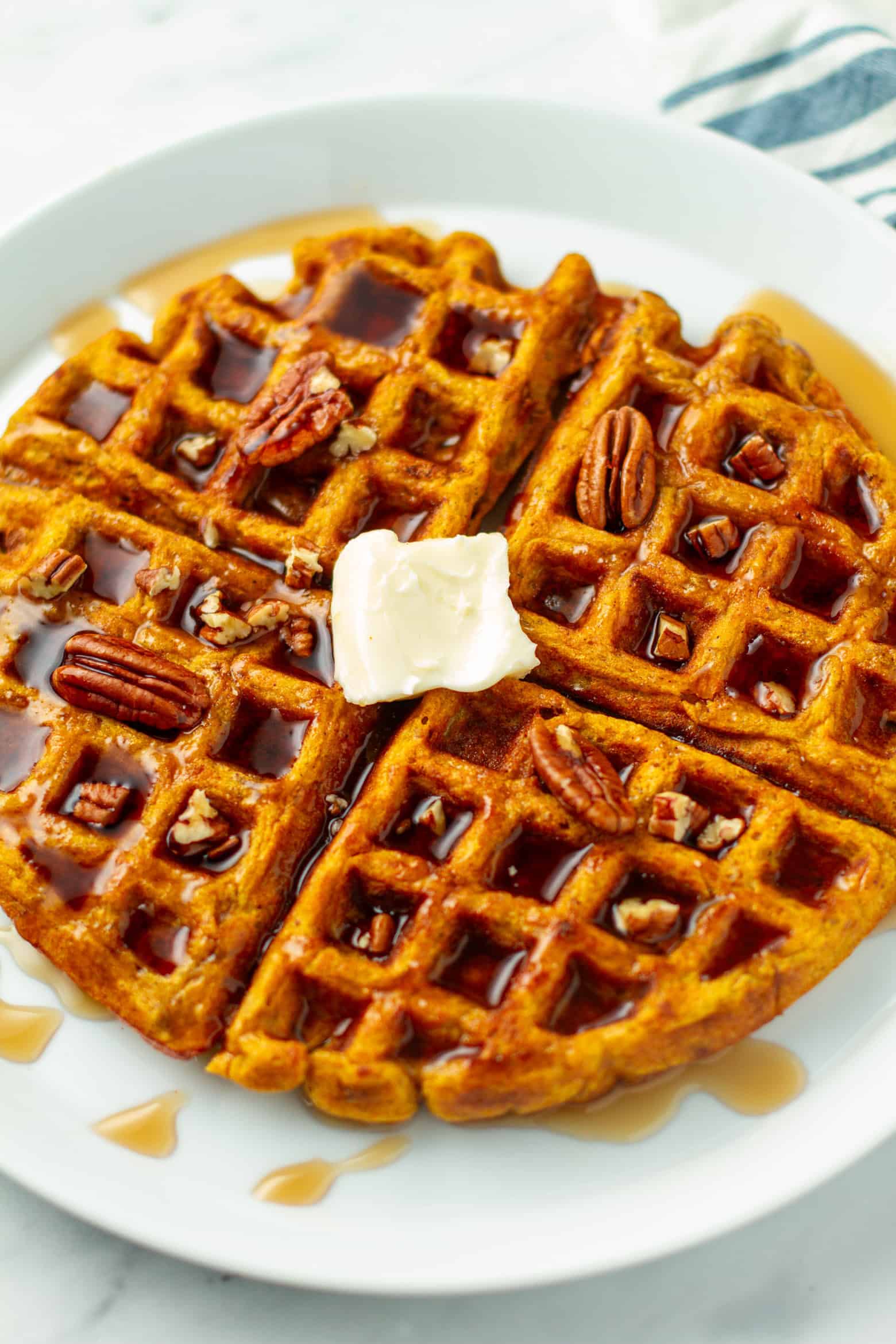Pumpkin Pecan Waffle on a plate.