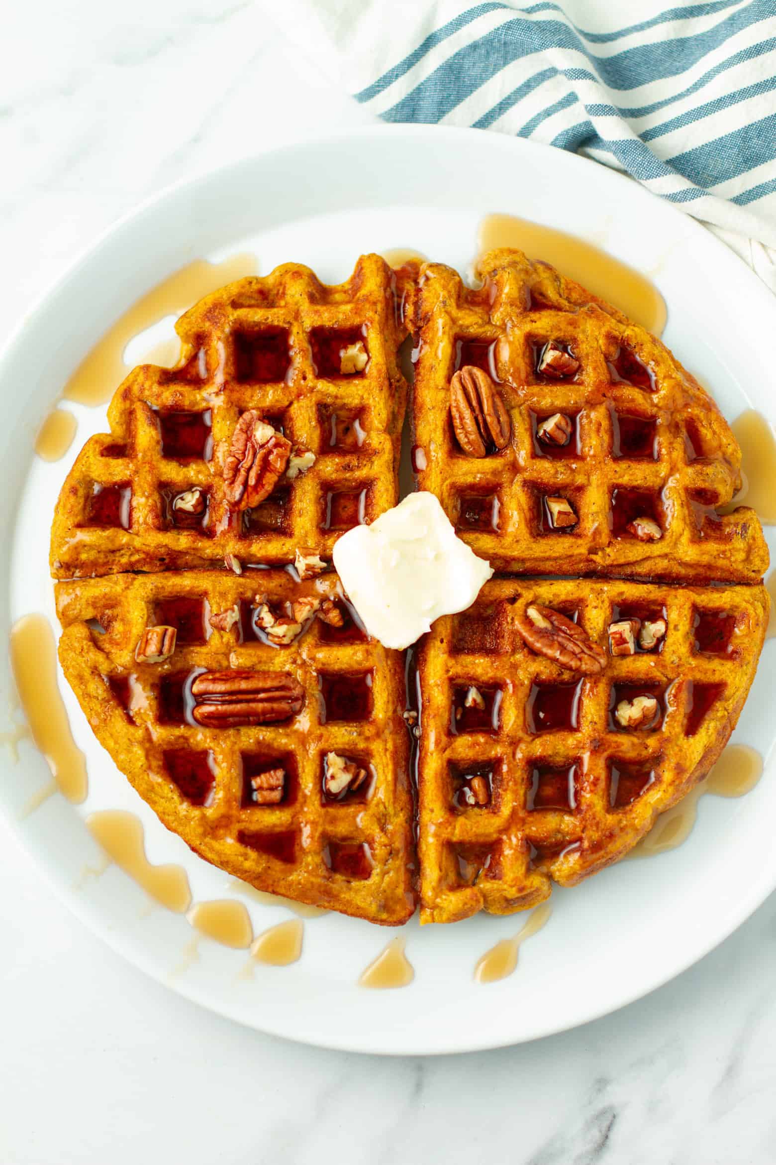 Pumpkin Pecan Waffle on a plate.