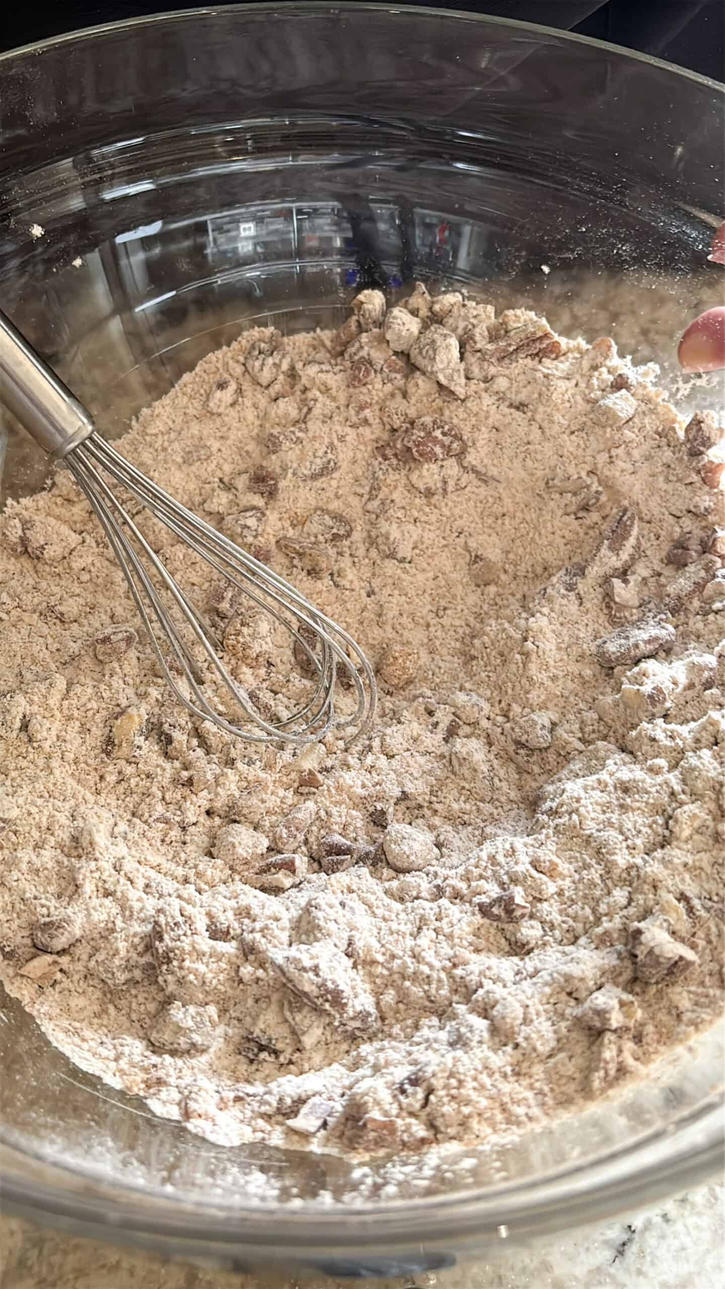 Pumpkin pecan waffles dry ingredients in a bowl.