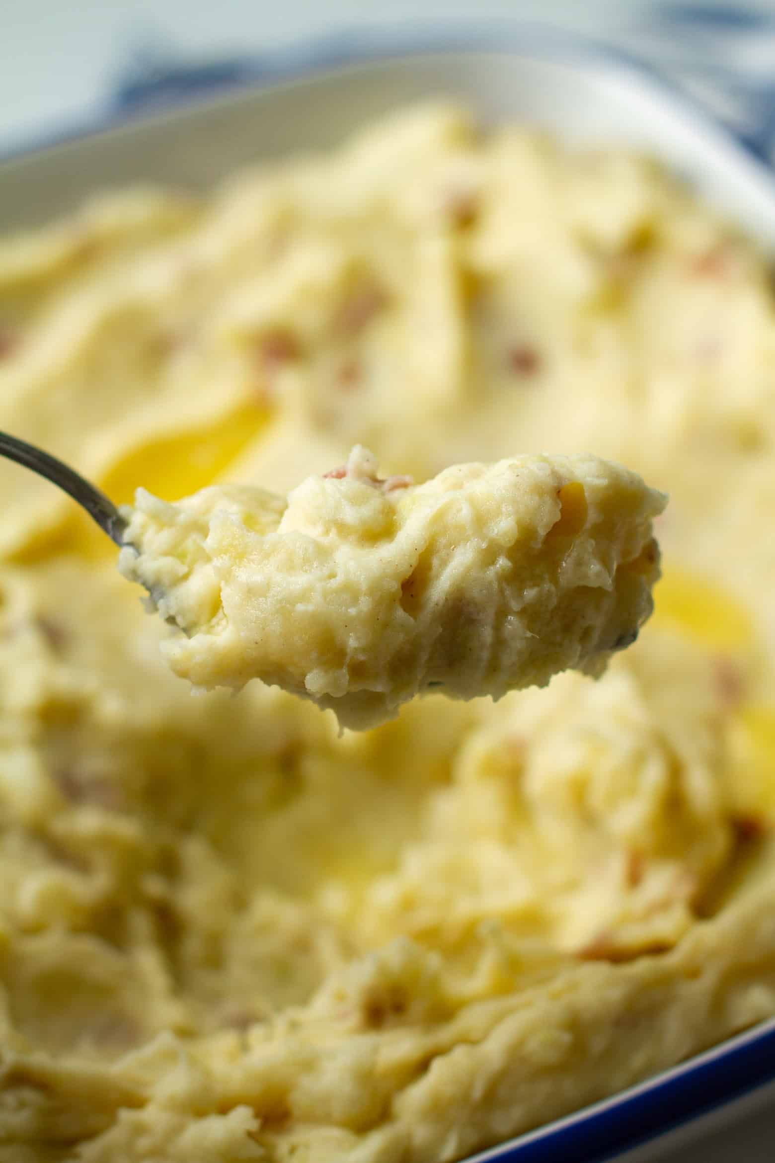 Red skin mashed on a fork.