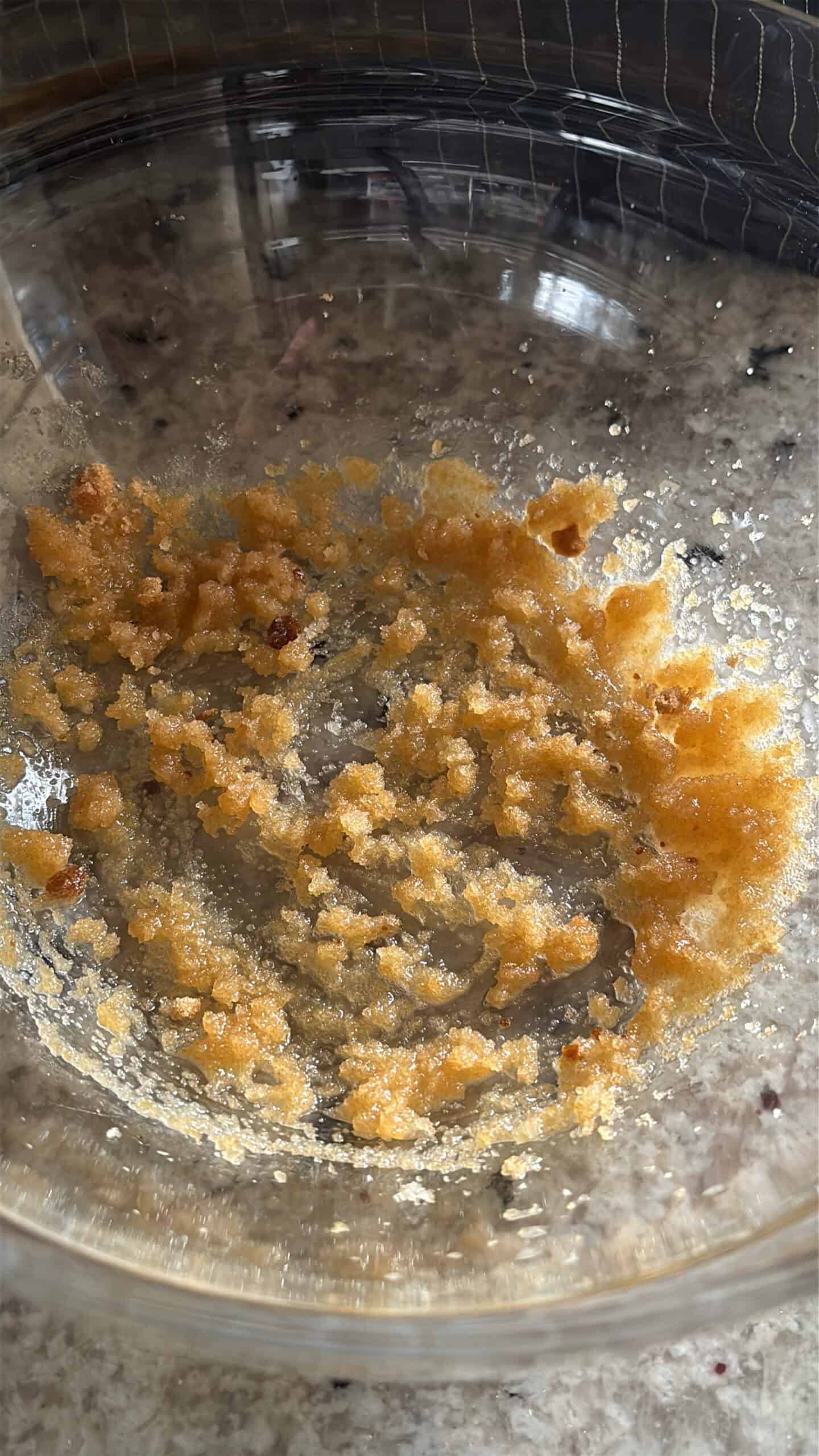 Butter and sugar combined in a bowl.