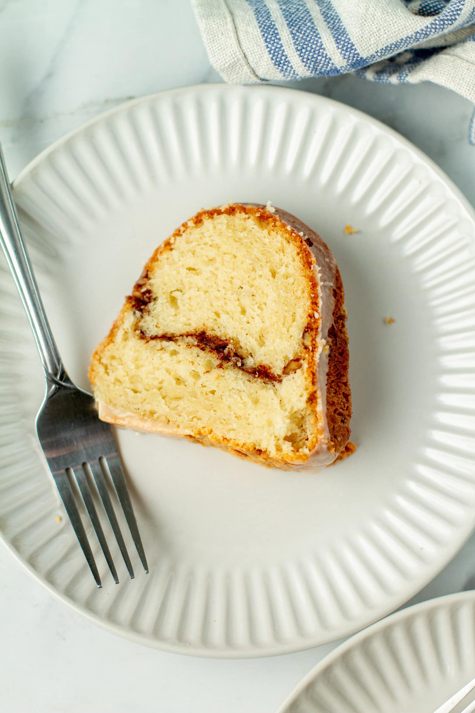 Slice of sock it to me cake on a plate.