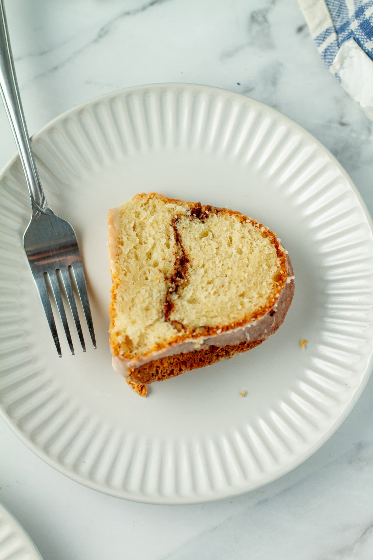 Slice of sock it to me cake on a plate.