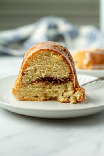 Slice of sock it to me cake on a plate.