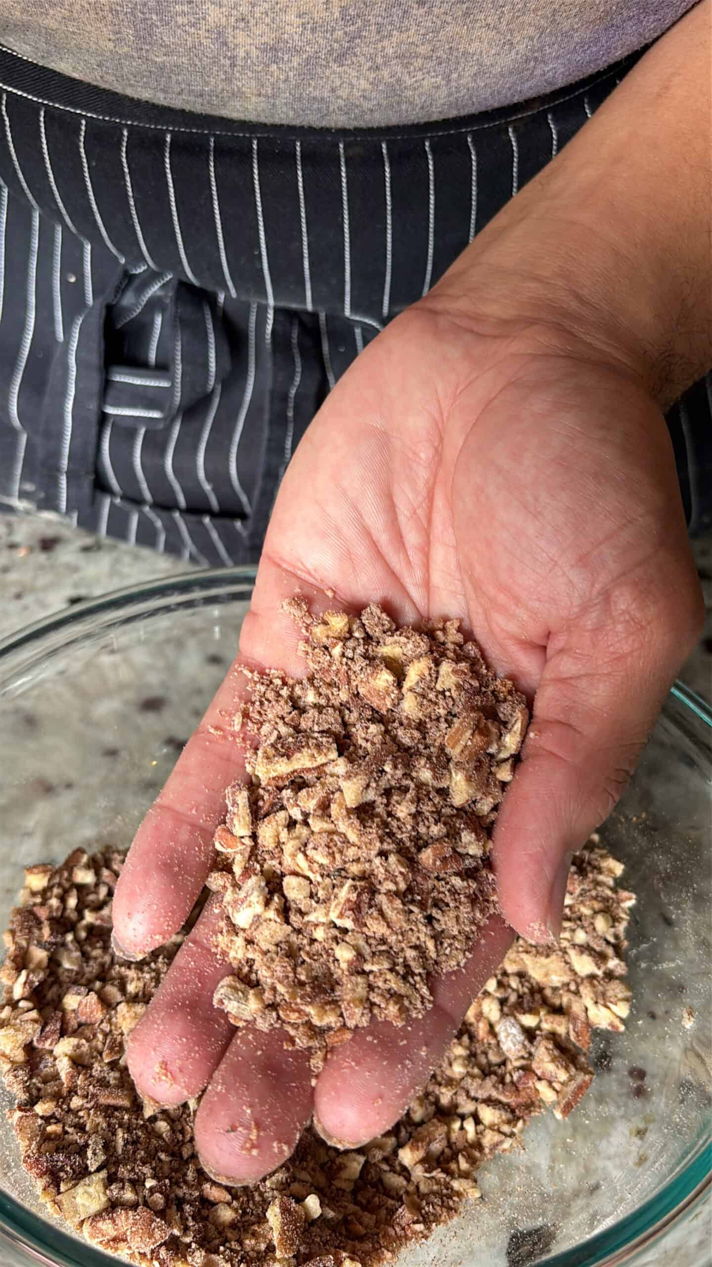 Sock it to me cake pecan filling in someone's hand.