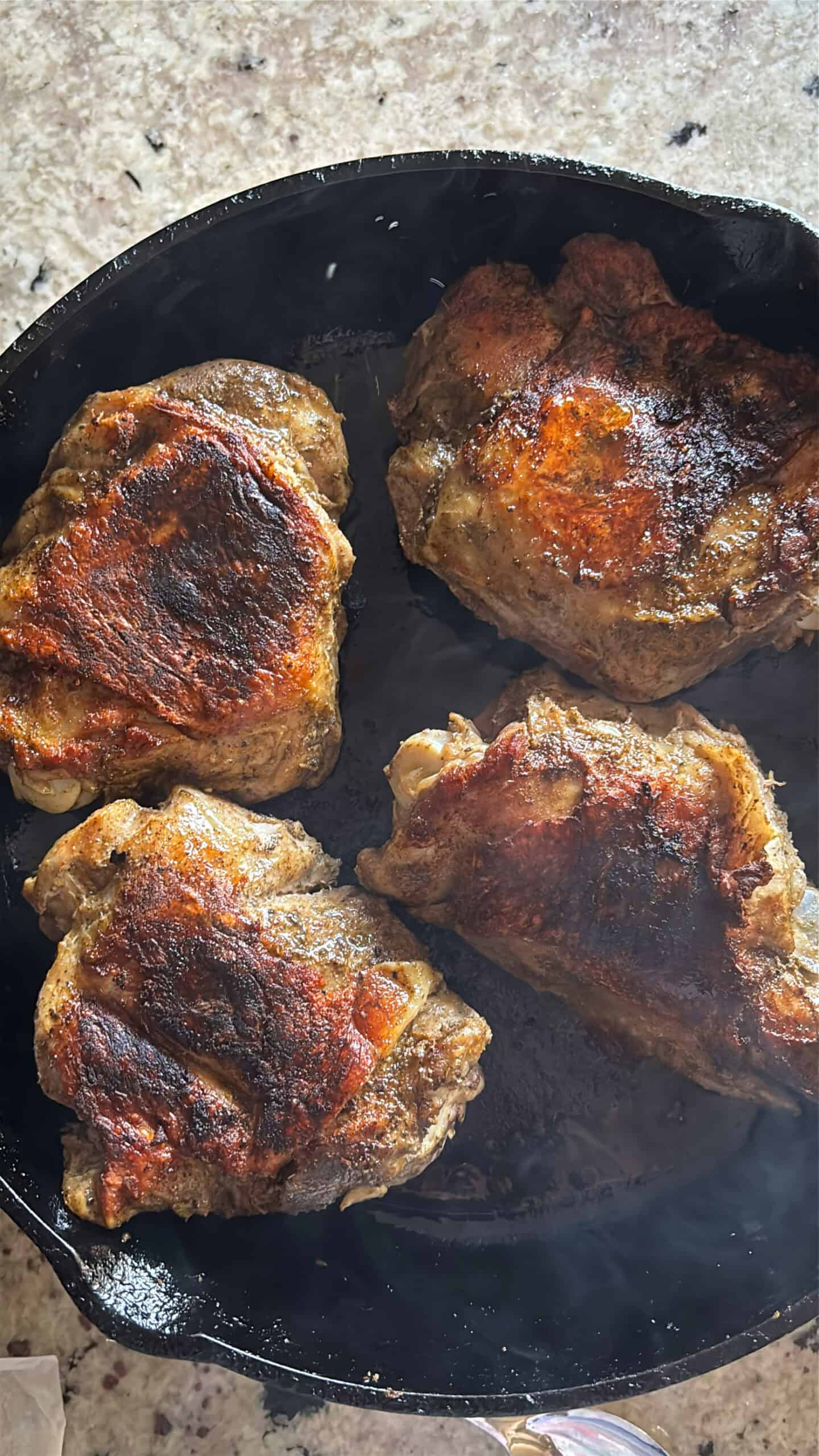 Golden brown skin on cooked turkey thighs.