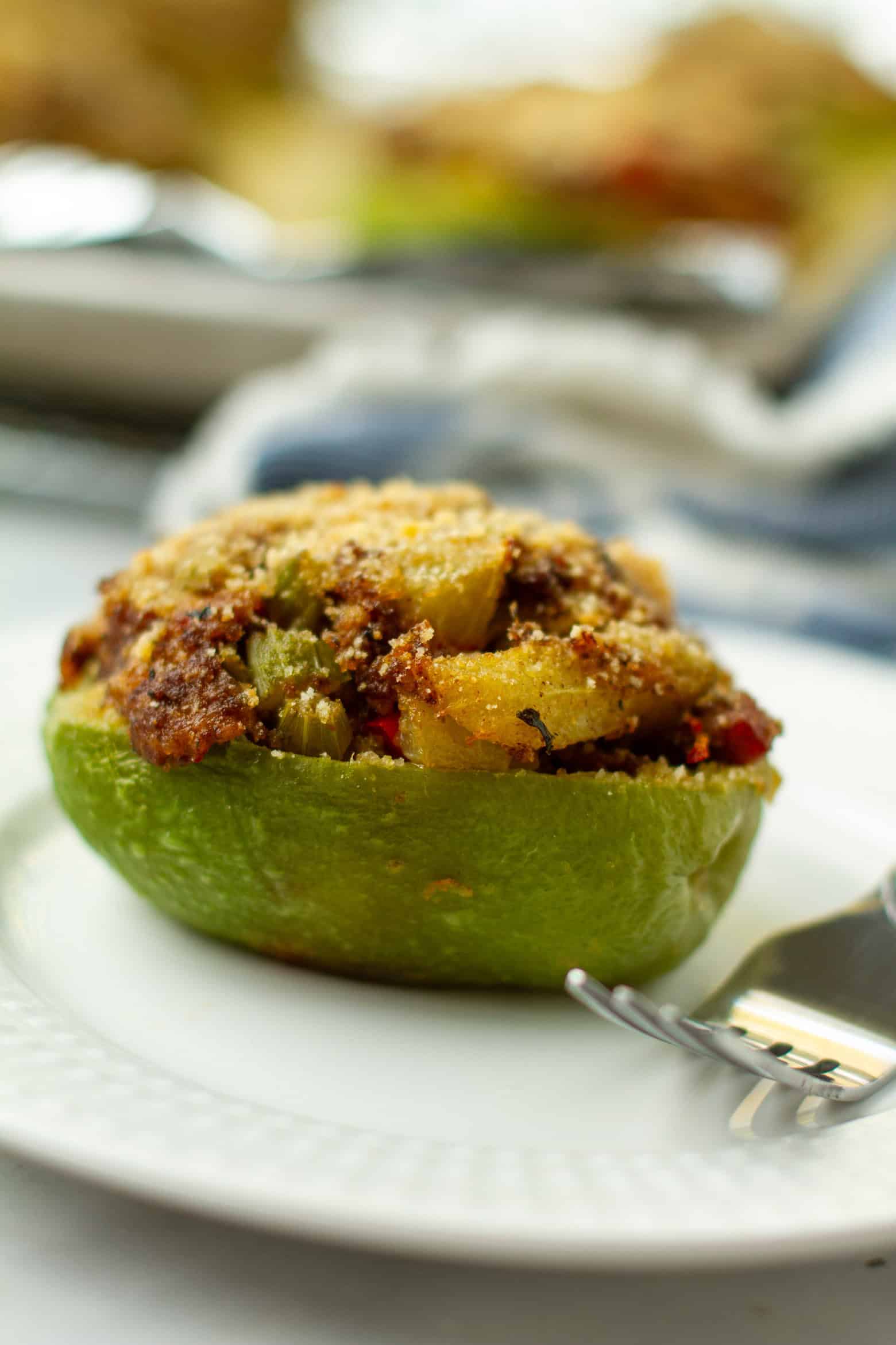 Stuffed mirliton on a plate.