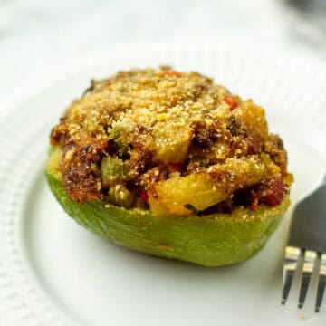 Stuffed mirliton on a plate.