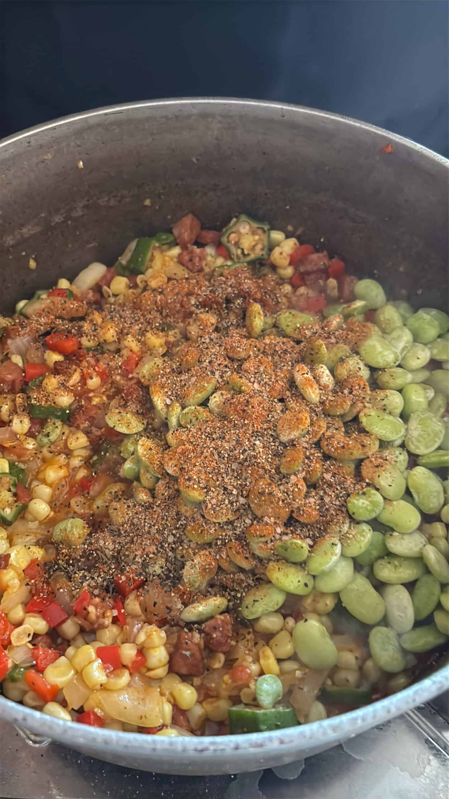 Lima beans and Cajun seasoning added to pot.