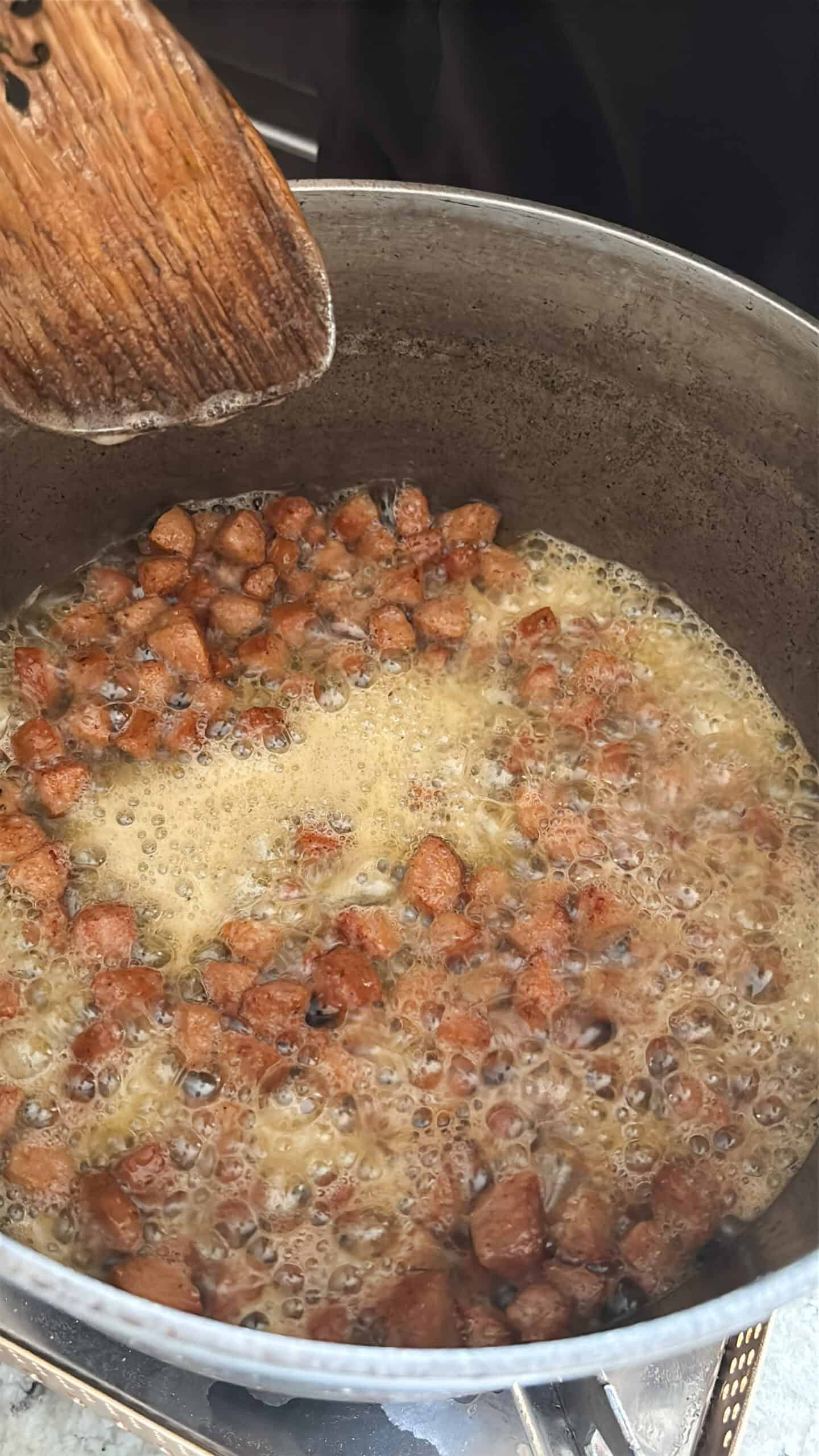 Sausage cooking in a pot.