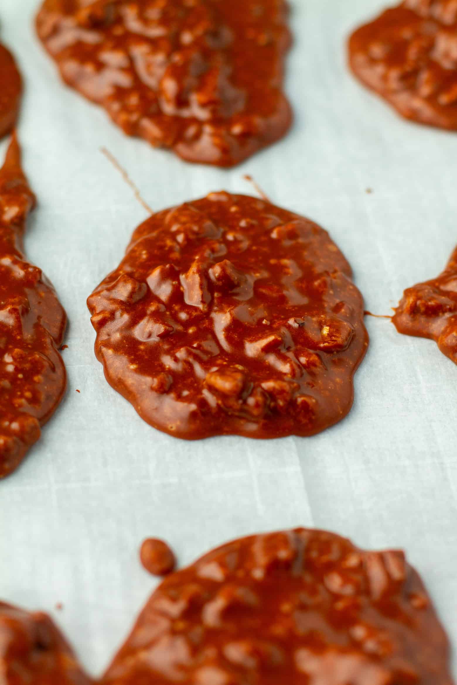 Chocolate Pralines cooling on a baking sheet.