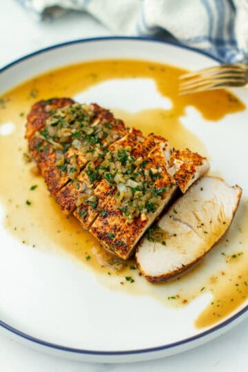 Oven Roasted Turkey Tenderloin on a plate with sauce.