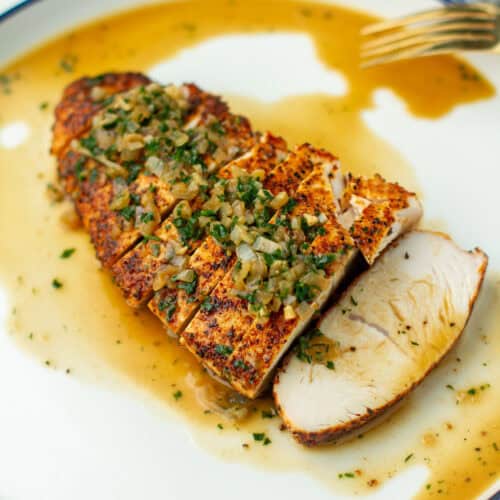 Oven Roasted Turkey Tenderloin on a plate with sauce.