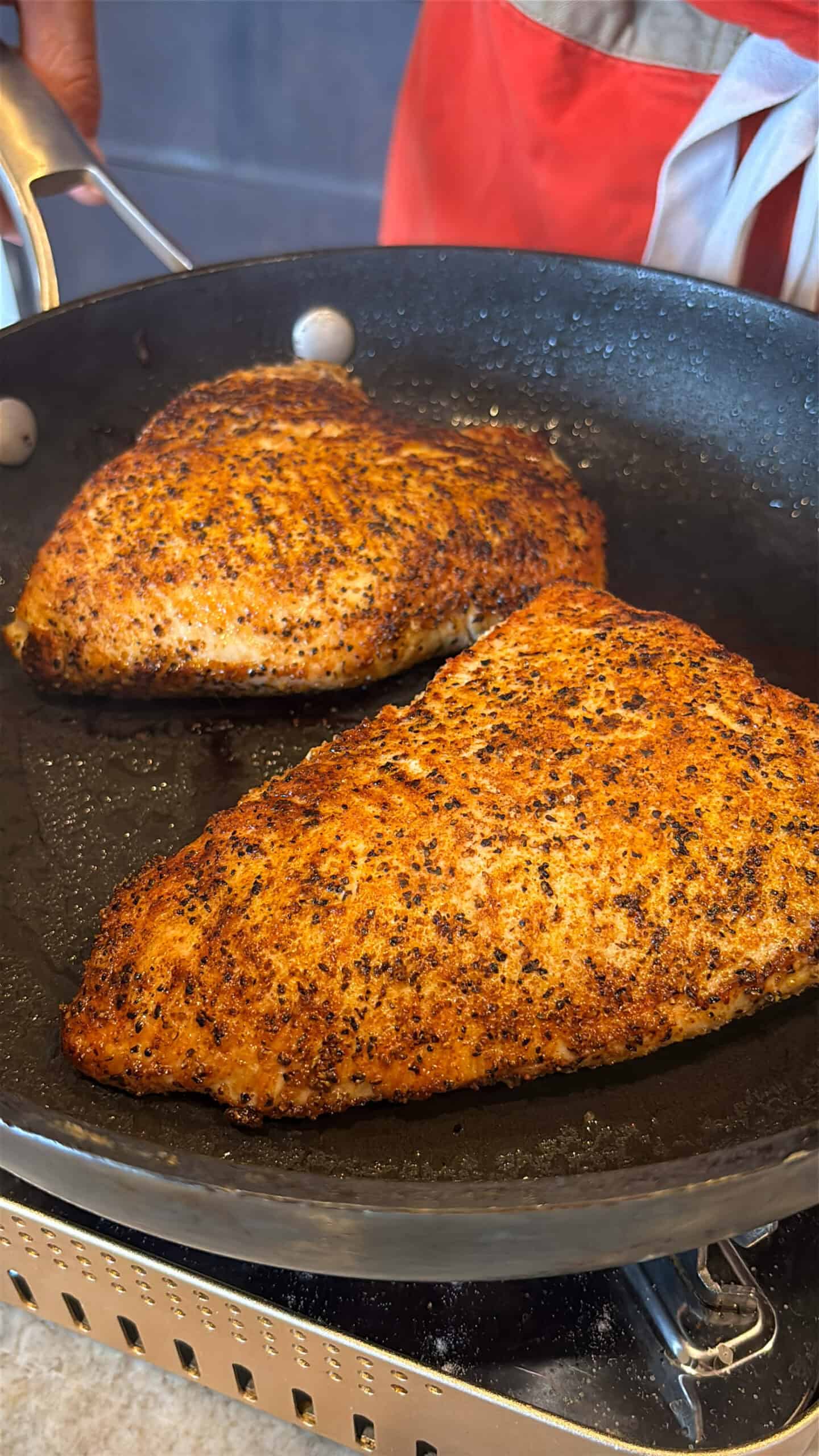 Oven Roasted Turkey Tenderloin cooking in a skillet before going in the oven.