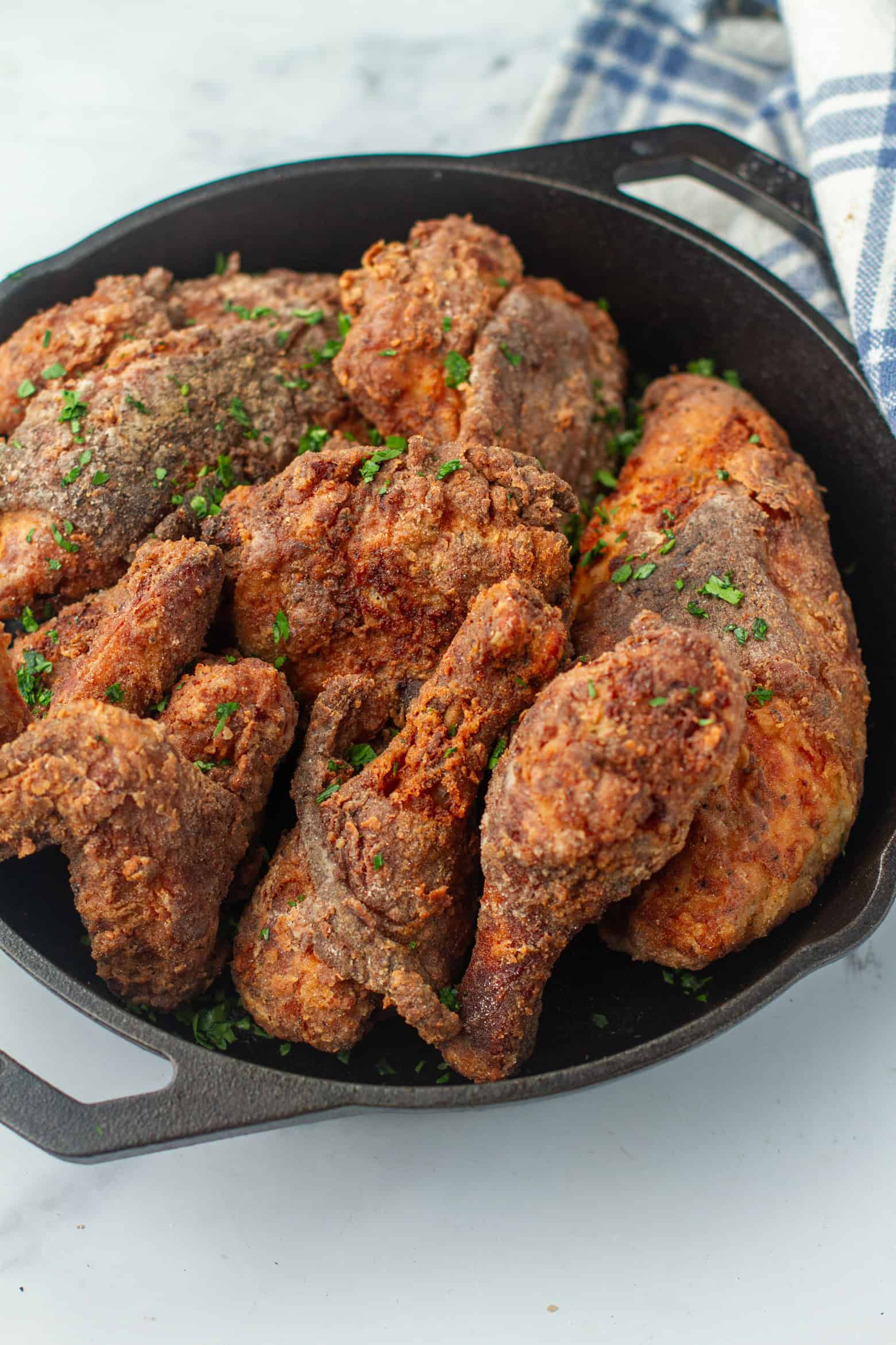 Sous vide fried chicken in a cast iron skillet.