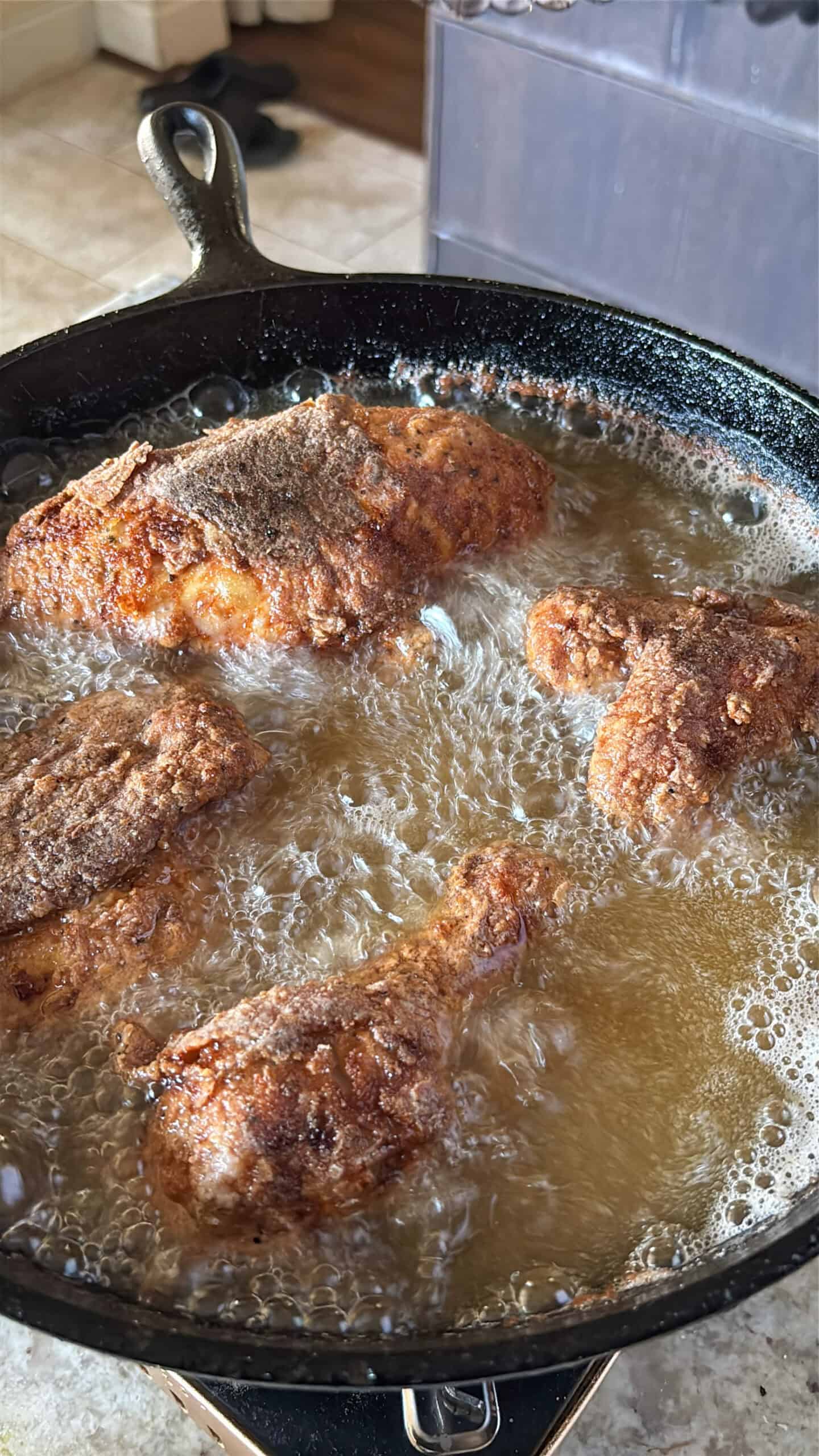 Chicken frying in hot oil.