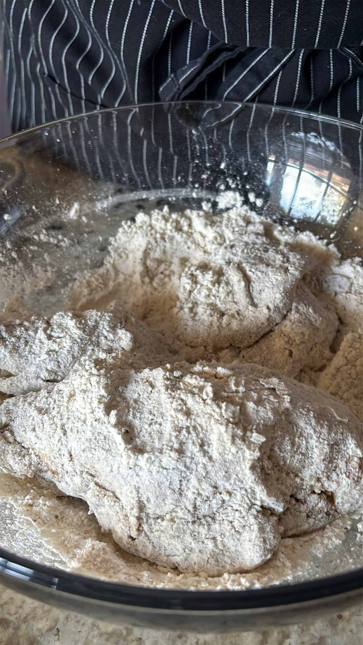 Chicken dredged in seasoned flour.