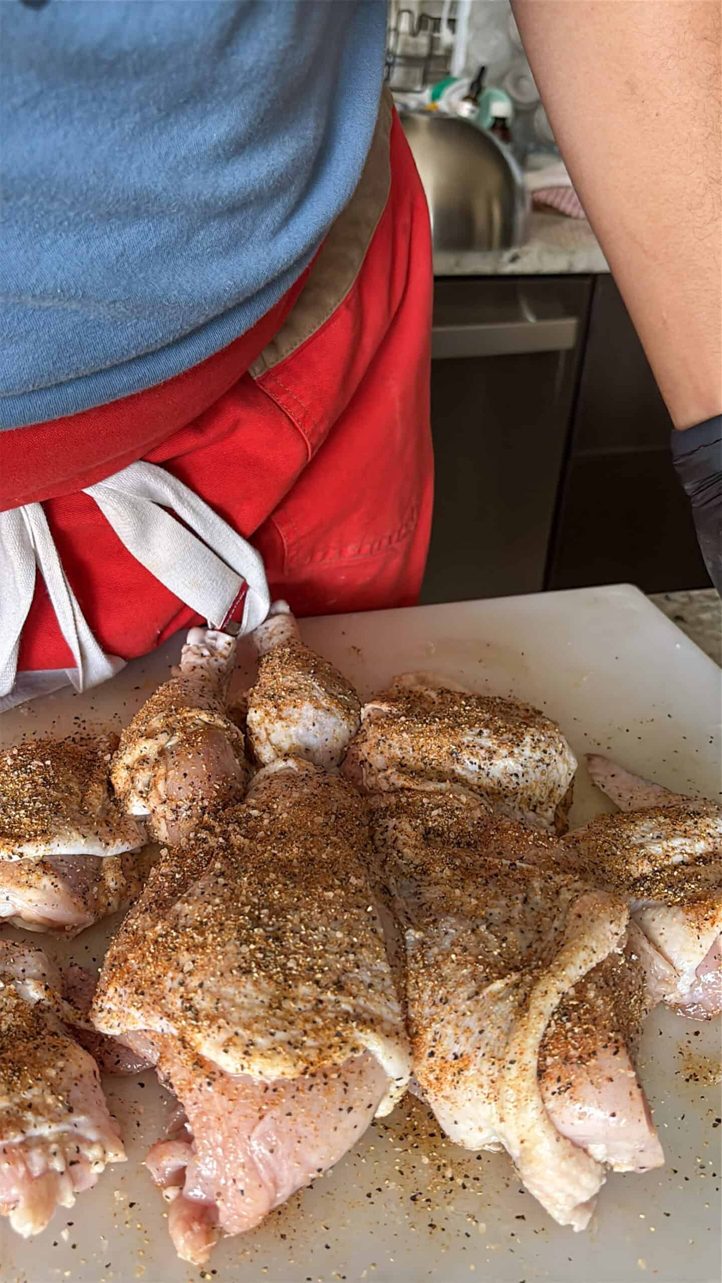 Cut up seasoned chicken.