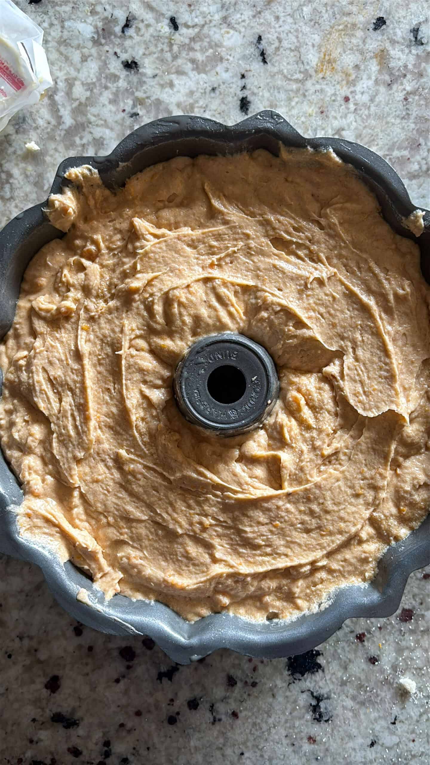 Cake batter in bundt pan before being baked.